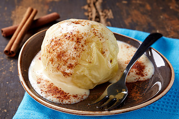 Image showing baked apple dessert with vanilla sauce