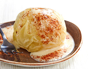 Image showing baked apple dessert with vanilla sauce