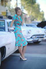 Image showing Lovely Woman Posing and and Around a Vintage Car