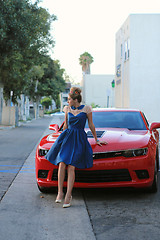 Image showing Woman Posing and and Around a Modern Car