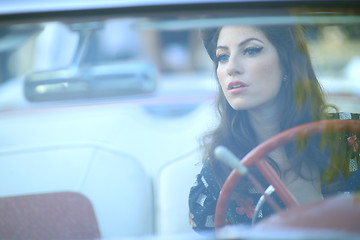 Image showing Lovely Woman Posing and and Around a Vintage Car