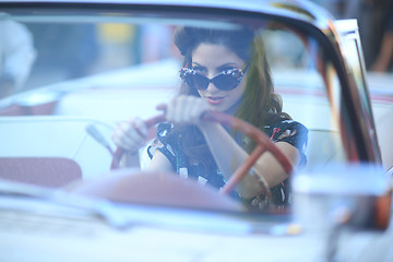 Image showing Lovely Woman Posing and and Around a Vintage Car