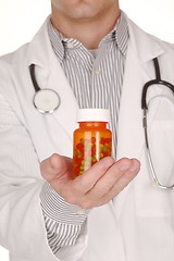 Image showing Doctor With Medication in Prescription Bottles