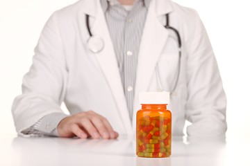 Image showing Doctor With Medication in Prescription Bottles