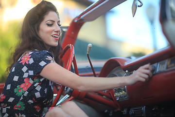 Image showing Lovely Woman Posing and and Around a Vintage Car