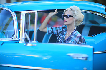 Image showing Lovely Woman Posing and and Around a Vintage Car