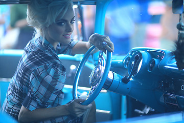 Image showing Lovely Woman Posing and and Around a Vintage Car