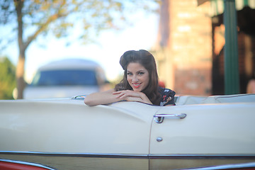 Image showing Lovely Woman Posing and and Around a Vintage Car