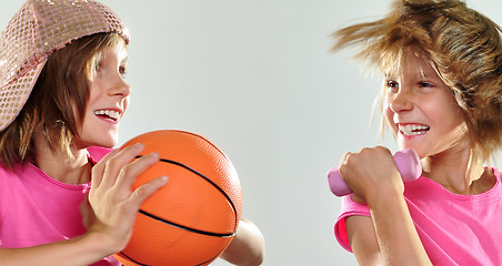 Image showing child exercising with dumbbells