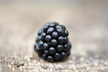 Image showing Blackberries on wooden plate - closeup