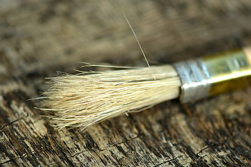 Image showing Paint brush on a old wooden background