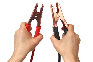 Image showing Hands with jumper cables on white