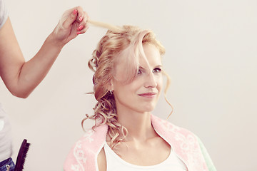 Image showing hair stylist designer making hairstyle for woman