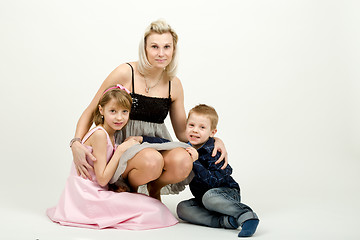 Image showing Studio portrait of siblings beautiful boy and girl and mother