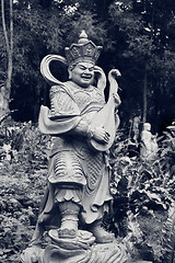 Image showing Aged asian god statue