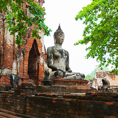 Image showing Ancient stone statue of Buddha in ruins of a Buddhist temple. Th