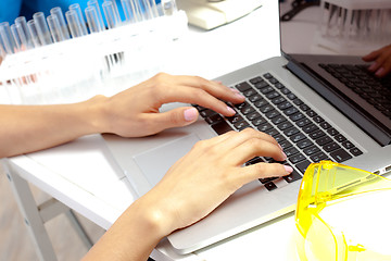 Image showing Scientist hands on keyboard