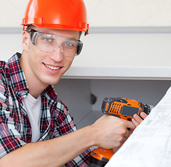 Image showing worker with drill