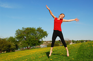 Image showing Young girl jumping