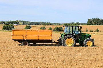 Image showing John Deere 5820 Agricultural Tractor with Trailer Full of Grain