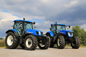 Image showing Two New Holland Agricultural Tractors