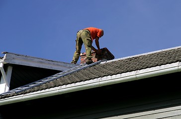 Image showing Man on a roof