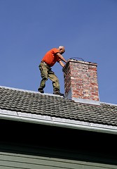 Image showing Man on a roof