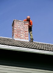 Image showing Man on a roof