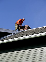 Image showing Man on a roof