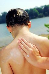 Image showing Applying sunscreen