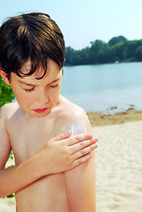 Image showing Applying sunscreen