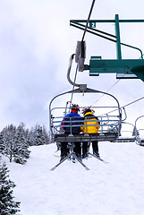 Image showing Skiers on chairlift
