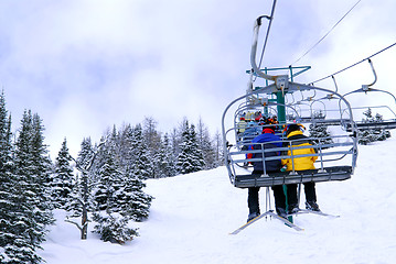 Image showing Skiers on chairlift