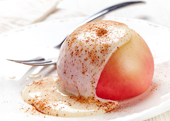 Image showing baked apple dessert with vanilla sauce