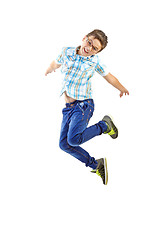 Image showing little boy jumping on white background