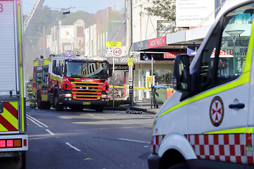 Image showing Fire and ambulance crews attend shop blast tragedy