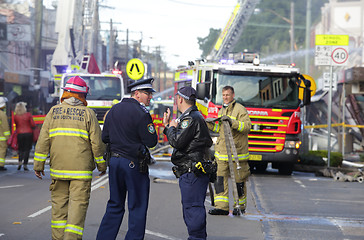 Image showing Police and Fire fighters attend blast explosion at shop