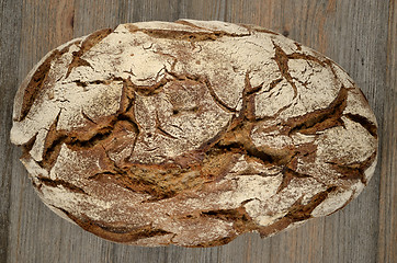 Image showing a loaf of rye bread on wood 