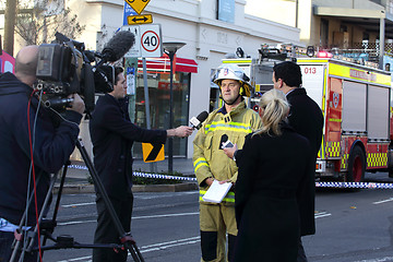 Image showing TV News Crews briefed by Fire Superintendant.
