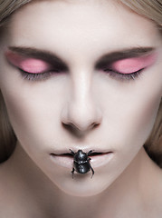 Image showing Beauty portrait of model with make-up and bug on her lips