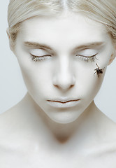 Image showing Hibernation and sleep: girl with closed eyes and insect 