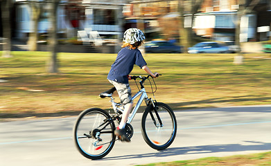 Image showing Boy riding a bike