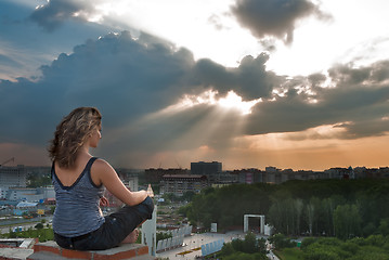 Image showing Attractive girl meditating at sunbeam