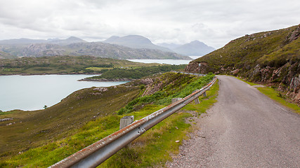 Image showing Highlands of Scotland narrow road in mountain landscape