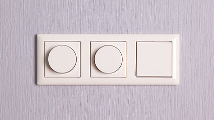 Image showing Lightswitches on a grey wall