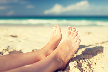 Image showing closeup of woman legs on sea shore