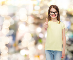 Image showing smiling cute little girl in black eyeglasses