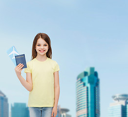 Image showing smiling little girl with ticket and passport