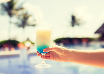 Image showing close-up of hand holding glass with cocktail