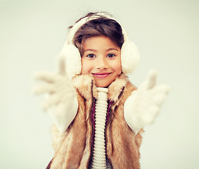 Image showing happy littl girl in winter clothes